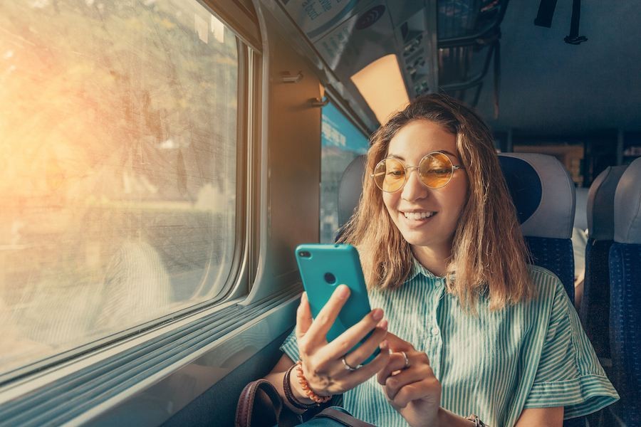 how to use ota marketing with person using mobile phone while on train