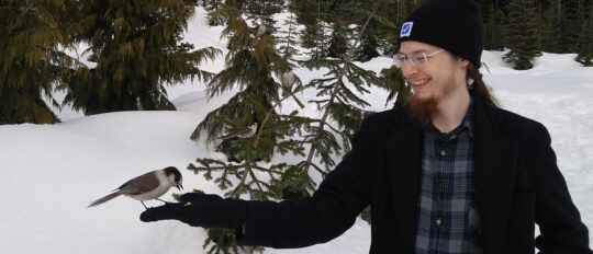 Male Checkfront employee on a winter nature walk