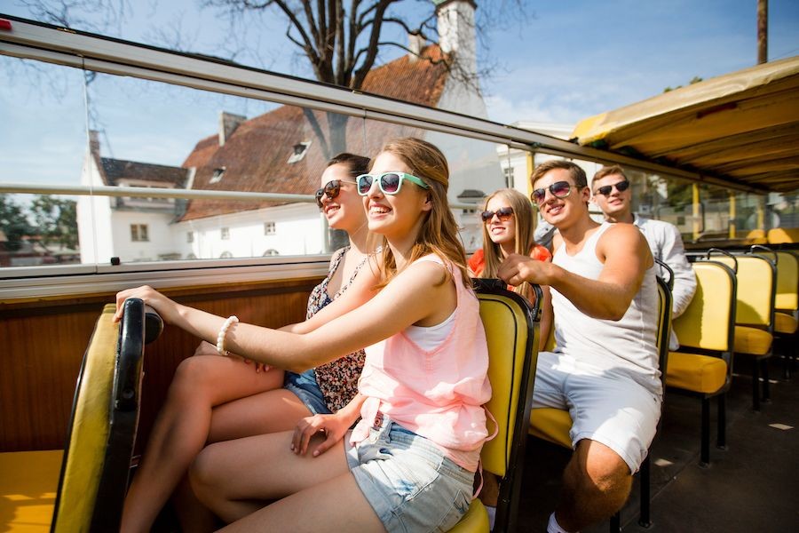 tour itinerary with guests traveling by open-top bus