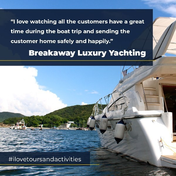 Yacht on water beside island with quote