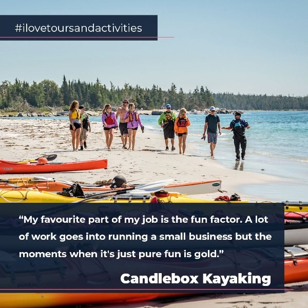 People walking along beach toward kayaks with quote