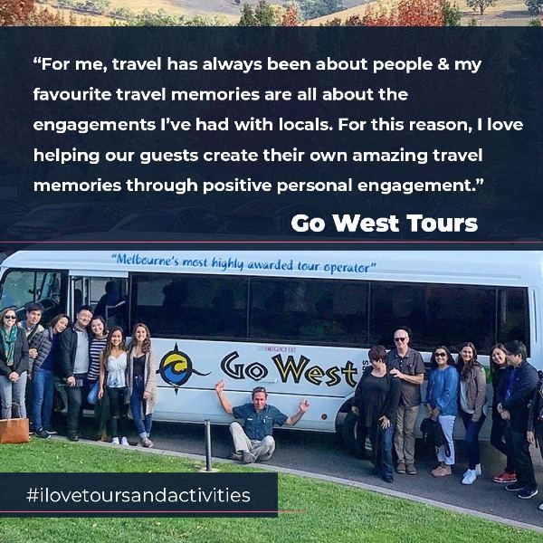 Tourists standing beside bus with quote