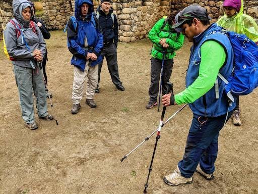 Listening to Wilson's tour guide storytelling during the Machu Picchu expedition.