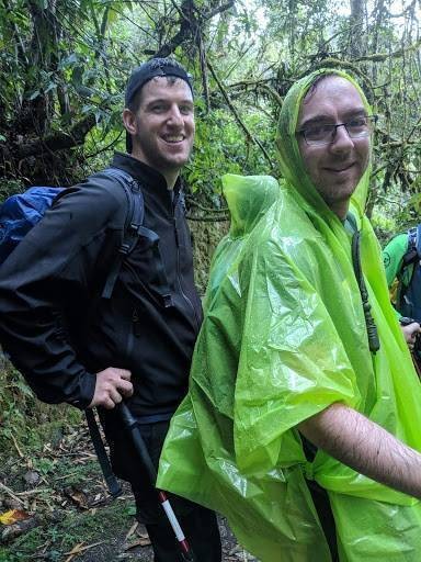 Scott and his friend wearing the green ponchos provided by Alpaca Expeditions.