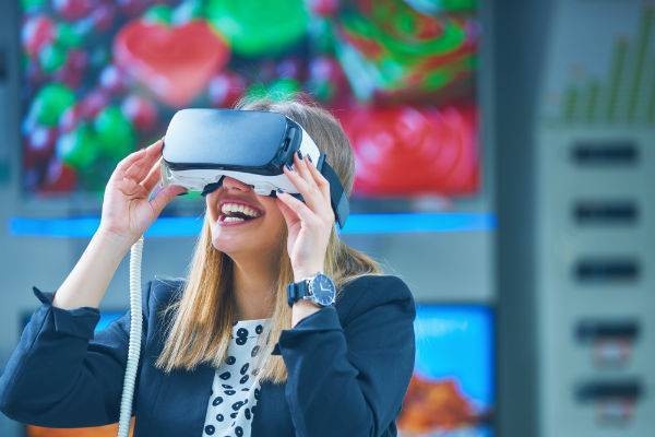Female smiling using virtual reality headset