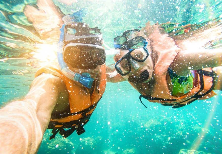 Senior couple enjoying a snorkel tour package