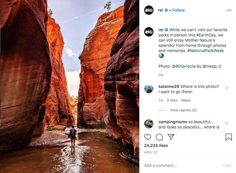 Instagram post by Rei using trending hashtags to engage customers