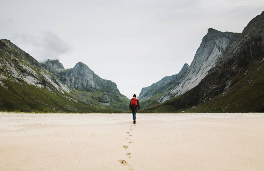 Man walking alone in mountainscape