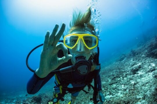 Scuba diver giving an OK sign