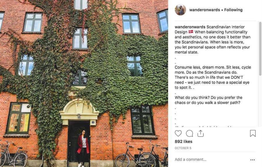 Instagram influencer post giving tips on what to do In Scandinavia with Vanessa standing in front of brick building covered in vines