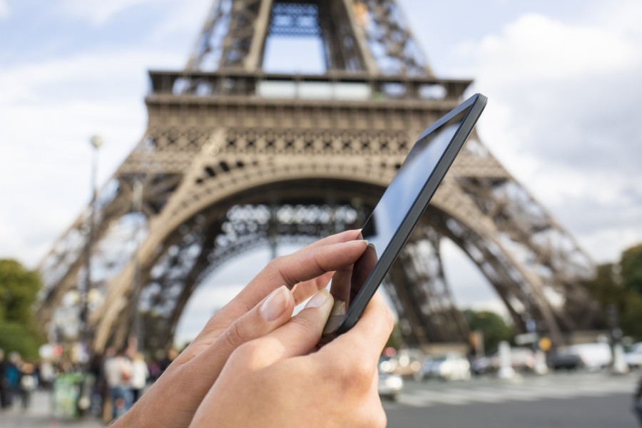 Close up of traveler using smartphone taking a Tiktok travel video at Eiffel Tower