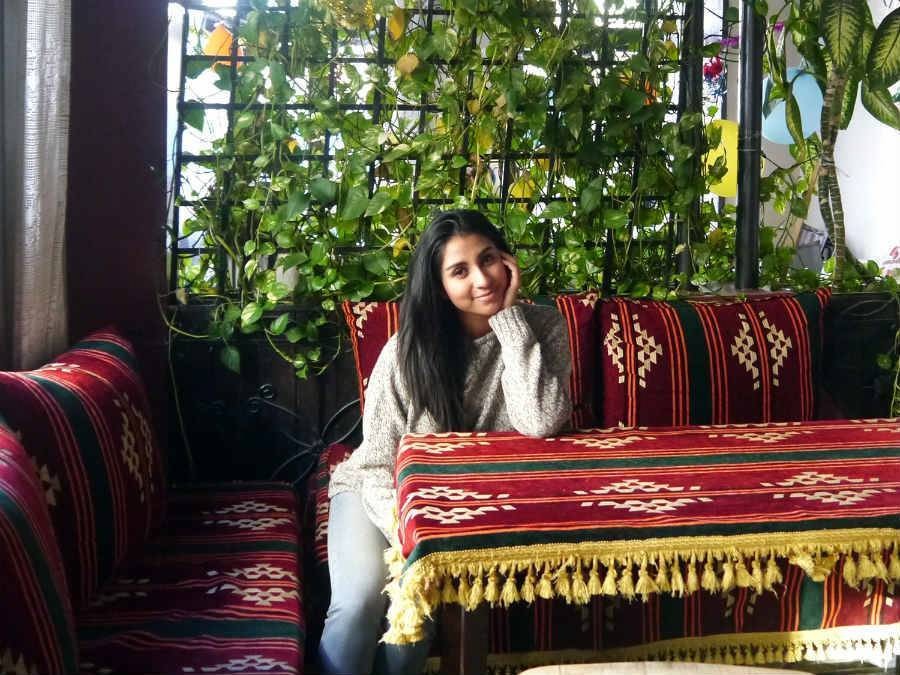 Travel influencer Vanessa of Wander Onwards sitting at restaurant in Asia