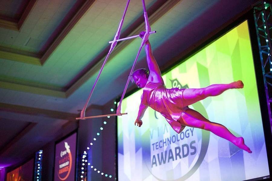 Acrobat swinging from rope during Viatec Awards 2016