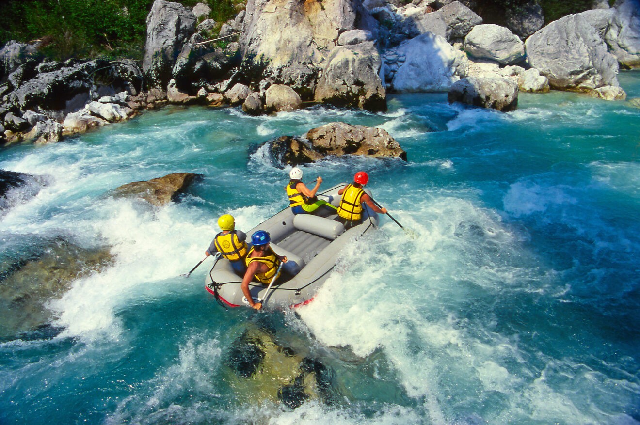 tourists white water rafting
